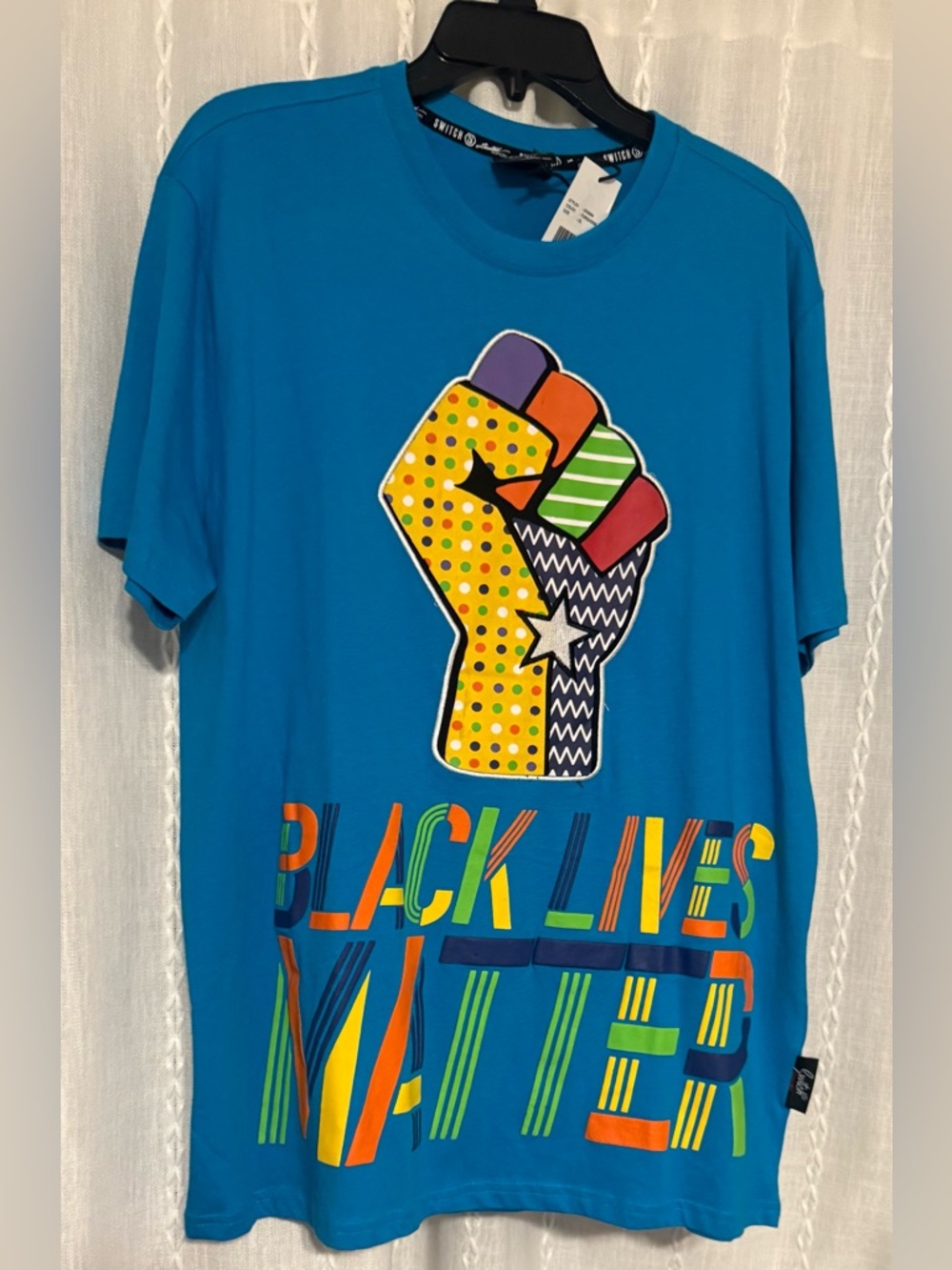 NWTs Switch brand blue t-shirt. Graphic of a raised fist & "Black Lives Matter"